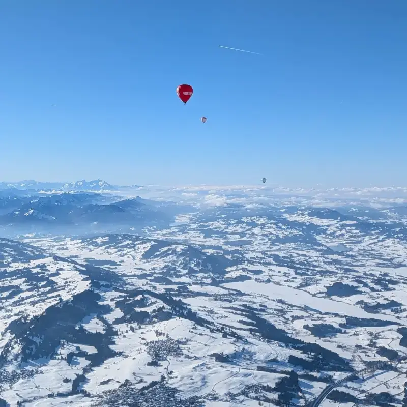 Alpine landscape with hot air balloon representing smooth sailing